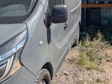 a van that is parked in front of a house