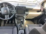 a picture of the interior of a car with a steering wheel