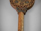 an old wooden paddle with a decorative design on it