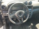 a steering wheel and dashboard of a small car