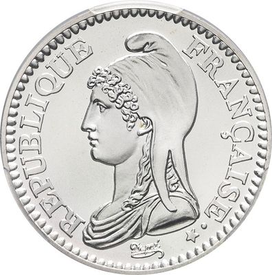 a close up of a coin with a woman ' s head on it