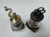 two salt and pepper shakers sitting on a table