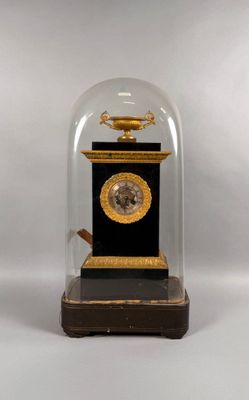 a glass dome with a clock inside of it