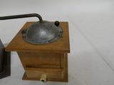 a coffee grinder sitting on top of a wooden table