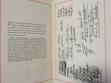 an open book with a handwritten page on the inside of it