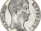 gros plan d'une pièce de monnaie sur laquelle figure une tête de femme
