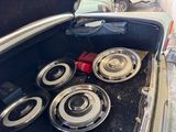 four speakers in the trunk of an old car