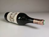 a bottle of wine that is sitting on a table