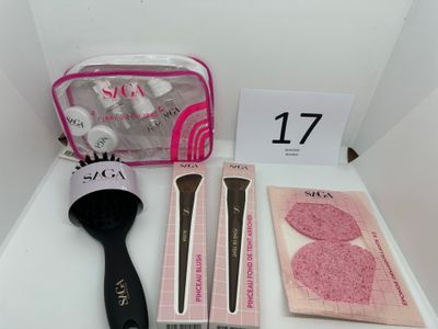 a bag of makeup brushes, a brush, and other items on a table