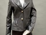 a mannequin wearing a black leather jacket and black pants