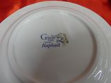 a white plate with a blue and white design on it