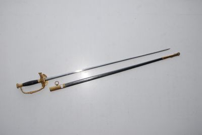 an old sword with a gold handle and a black handle