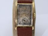 an image of a wrist watch with a brown leather band