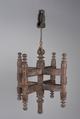 an image of a wooden chandelier hanging from a chain