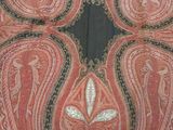 an image of a close up of a red and black paisley design