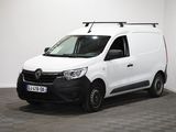 la camionnette blanche est garée dans une pièce au sol en damier