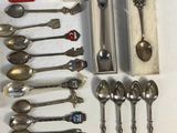 a lot of silver spoons and spoon spoons in a box