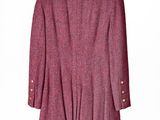 purple and black jacket on a hanger on a white wall