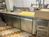 a kitchen with a lot of counter space and a lot of food on the counter