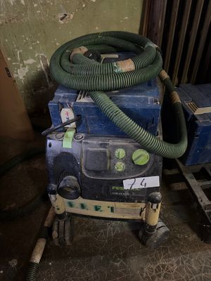a blue box with a green hose and a blue box with a green hose
