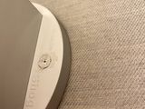 a close up of a laptop on a stand on a table