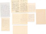 a group of old letters and papers on a white surface