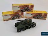three toy army vehicles sitting next to each other on a white surface