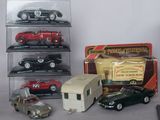 many different toy cars on display in a display case