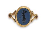an image of a gold ring with a silhouette of a woman holding a tennis racquet