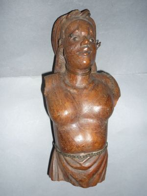 wooden bust of a man with a turban on his head
