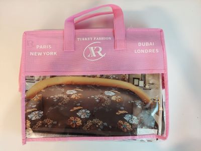 a pink bag with a chocolate covered donut inside of it