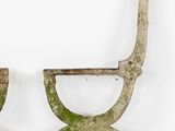 pair of antique iron giraffes with green paint on their legs
