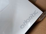 a white laptop in a box with the logo on it