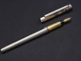 two different types of fountain pens on a black surface