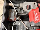 a tool box with a drill and a hammer in it