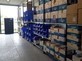 many boxes on the shelves in the warehouse