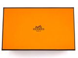 a box with a logo on it sitting on top of a white surface