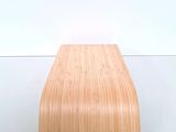 a wooden shelf that is on a white wall