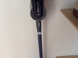 an image of a black and silver vacuum in a room