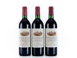 three bottles of red wine sitting next to each other on a white surface