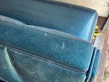 a close up of a blue seat on a bus