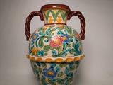 a large vase with a handle on a white background