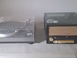 two turntables sitting on a table in a room