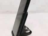 a cell phone that is sitting on a stand