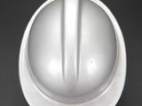 a white hard hat on a black table