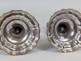pair of silver plated candlesticks on a white background