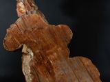 an image of a wooden sculpture of a person on a horse