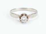 a close up of a diamond ring on a white background