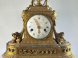 a clock that is sitting on top of a table