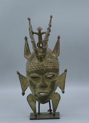 an image of a statue of a person on top of a head